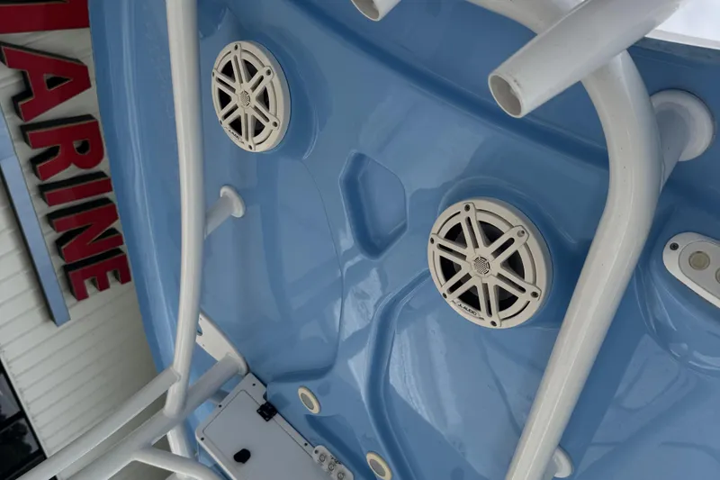 Slide: The Image of 2020 Tidewater 210 CC Adventure boat with blue hull and marine speakers. - 17