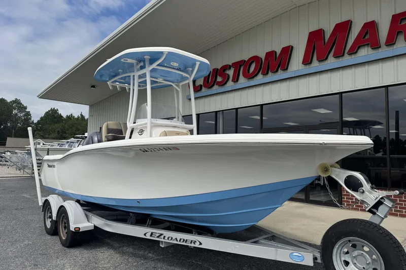 Slide: The Image of 2020 Tidewater 210 CC Adventure boat on trailer outside dealership. - 18