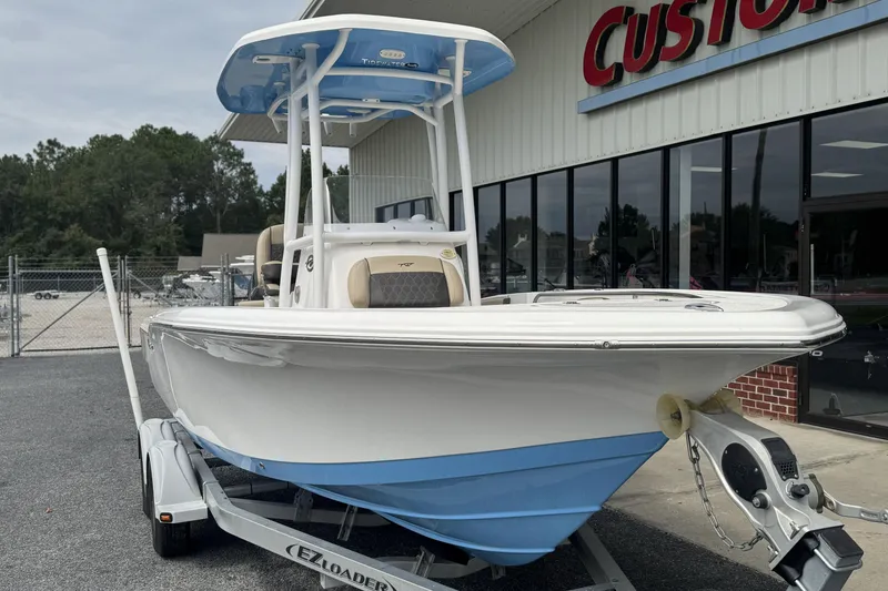 Slide: The Image of 2020 Tidewater 210 CC Adventure boat on trailer outside dealership. - 19