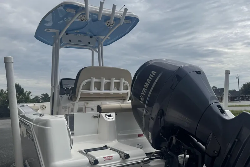 Slide: The Image of 2020 Tidewater 210 CC Adventure boat with Yamaha outboard motor, under cloudy sky. - 6