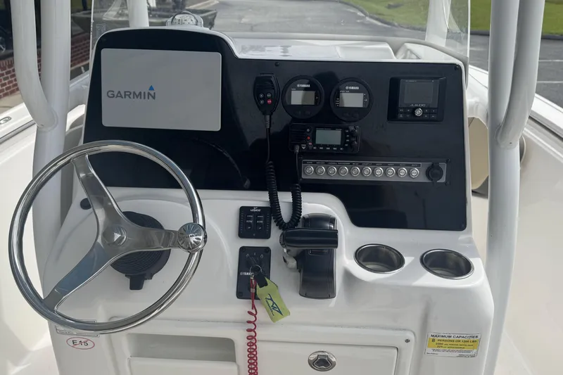 Slide: The Image of 2020 Tidewater 210 CC Adventure boat dashboard with Garmin navigation and Yamaha controls. - 7