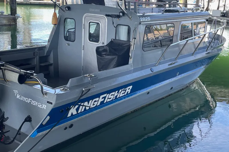 Slide: The Image of 2017 KingFisher 2825 Offshore boat docked in marina, side view. - 2