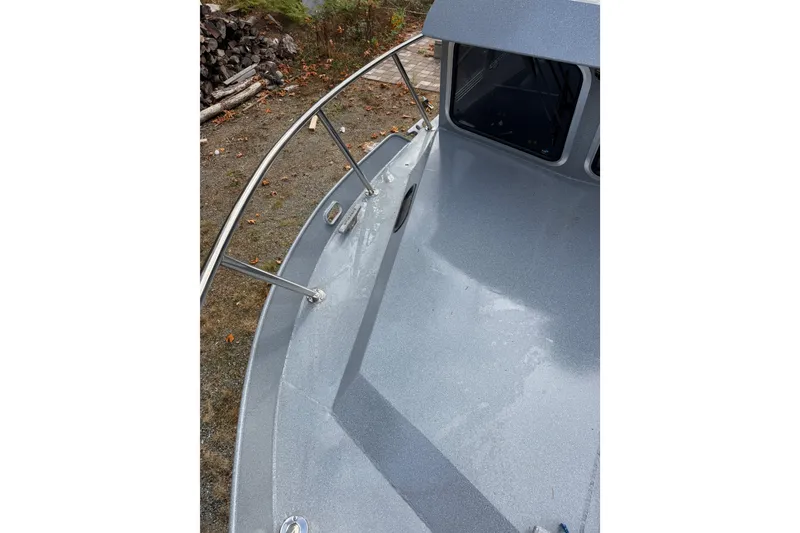 Slide: The Image of 2017 KingFisher 2825 Offshore boat deck with railing and windows. - 34