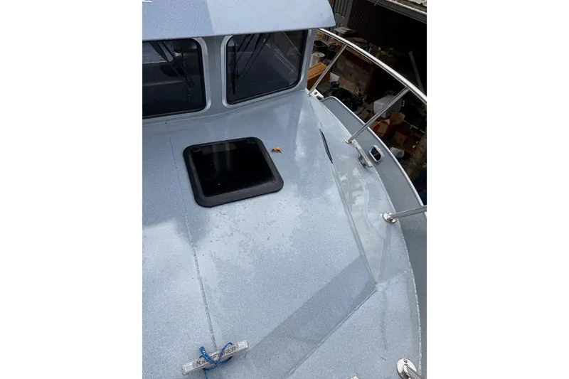 Slide: The Image of 2017 KingFisher 2825 Offshore boat deck with hatch and railing. - 35