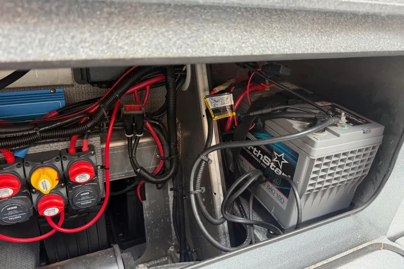 Slide: The Image of Battery compartment of a 2017 KingFisher 2825 Offshore boat with wiring and connections. - 41