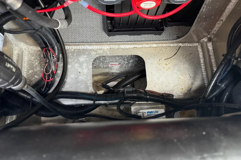 Slide: The Image of Engine compartment of a 2017 KingFisher 2825 Offshore boat, showing wiring and components. - 42