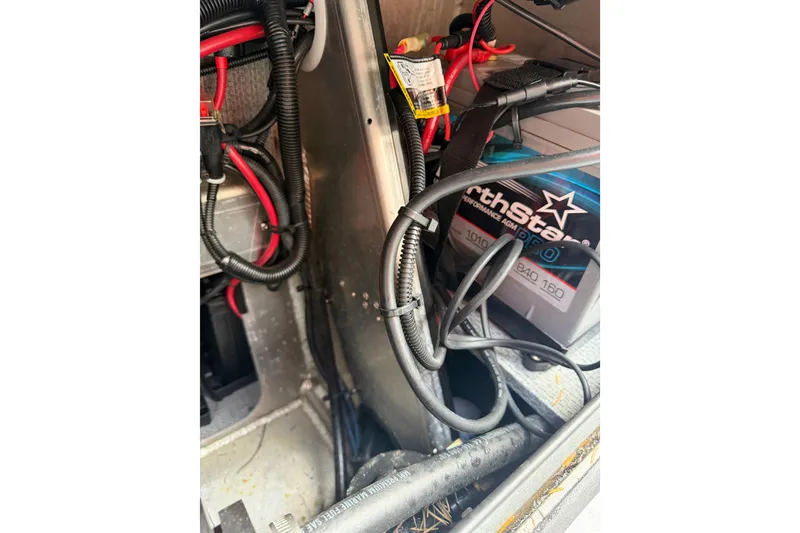 Slide: The Image of Electrical wiring and battery setup in a 2017 KingFisher 2825 Offshore boat. - 46