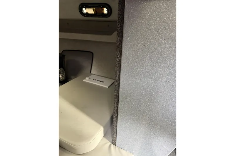 Slide: The Image of Interior of 2017 KingFisher 2825 Offshore boat cabin with seating and window. - 61