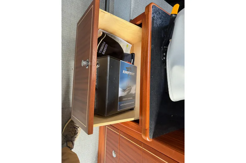 Slide: The Image of Open drawer with KingFisher 2825 Offshore 2017 manual and items inside. - 64