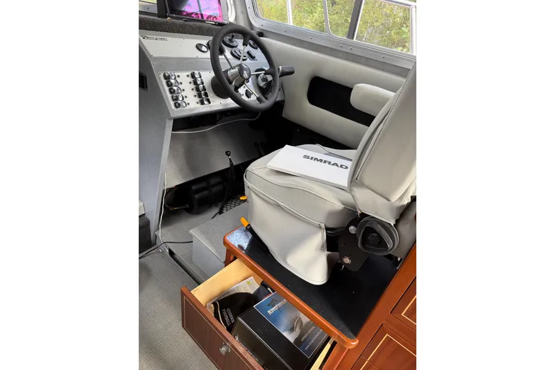 Slide: The Image of Interior of 2017 KingFisher 2825 Offshore boat with steering wheel and control panel. - 65