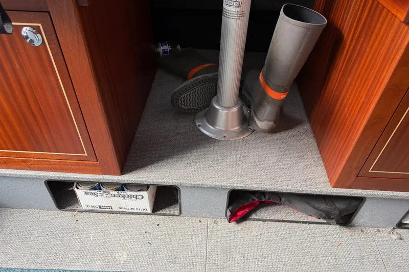 Slide: The Image of 2017 KingFisher 2825 Offshore interior with boots, storage, and wooden cabinetry. - 66