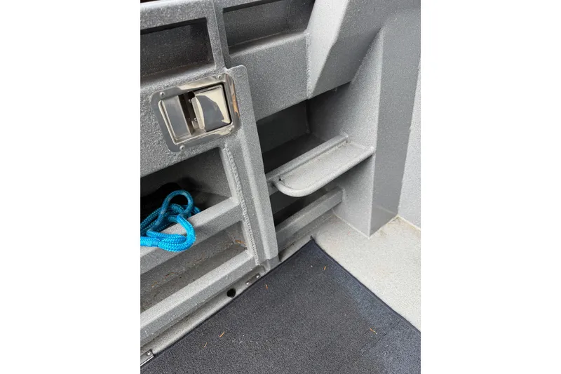 Slide: The Image of Interior detail of 2017 KingFisher 2825 Offshore boat with storage compartment and blue rope. - 83