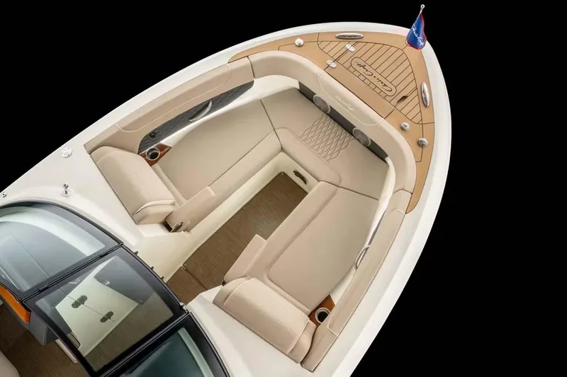 Slide: The Image of 2026 Chris-Craft Sportster 28 boat in showroom, featuring sleek design and modern amenities. - 2