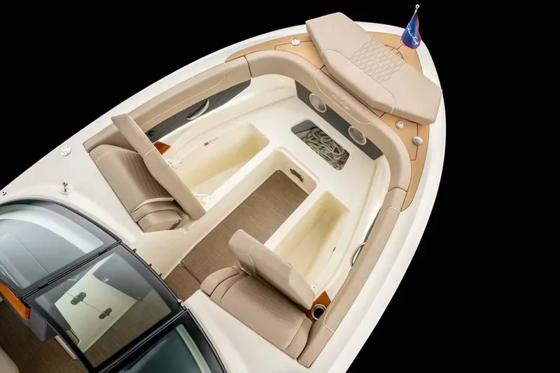 Slide: The Image of 2026 Chris-Craft Sportster 28 boat in showroom, showcasing sleek design and luxury features. - 3