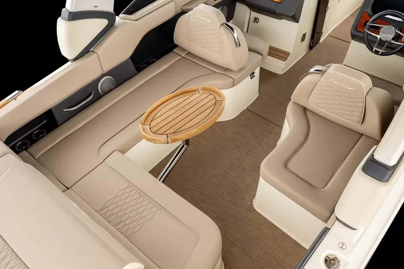 Slide: The Image of 2026 Chris-Craft Sportster 28 interior with blue and beige seating, dock view. - 6
