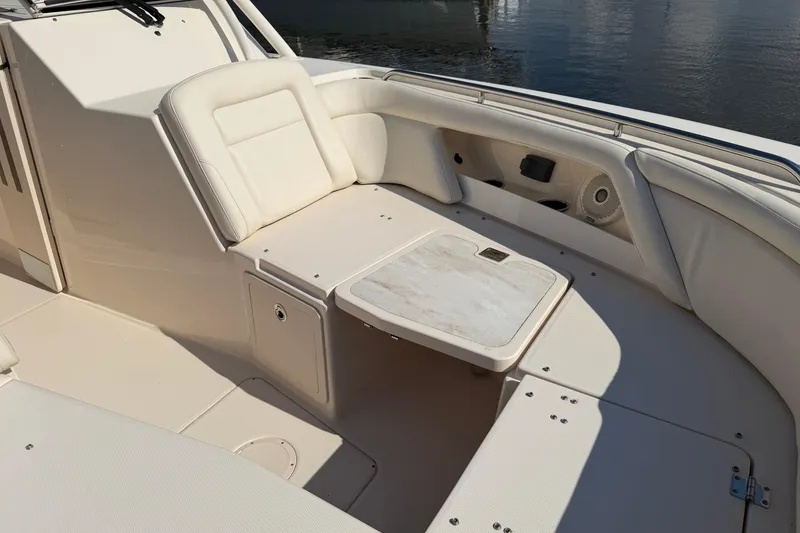Slide: The Image of 2017 Grady-White Freedom 335 boat interior with seating and table. - 10
