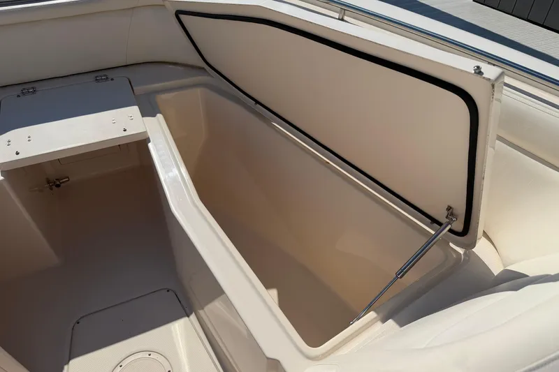 Slide: The Image of Open storage compartment on 2017 Grady-White Freedom 335 boat, showcasing spacious interior. - 15