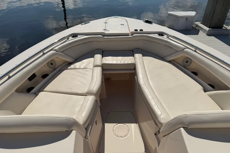 Slide: The Image of 2017 Grady-White Freedom 335 boat interior with cushioned seating and sleek design. - 17