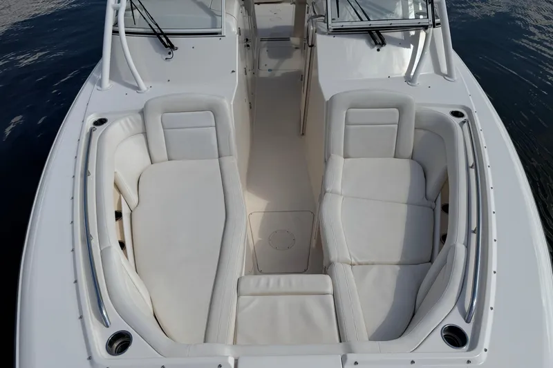 Slide: The Image of 2017 Grady-White Freedom 335 boat interior with white cushioned seating. - 22
