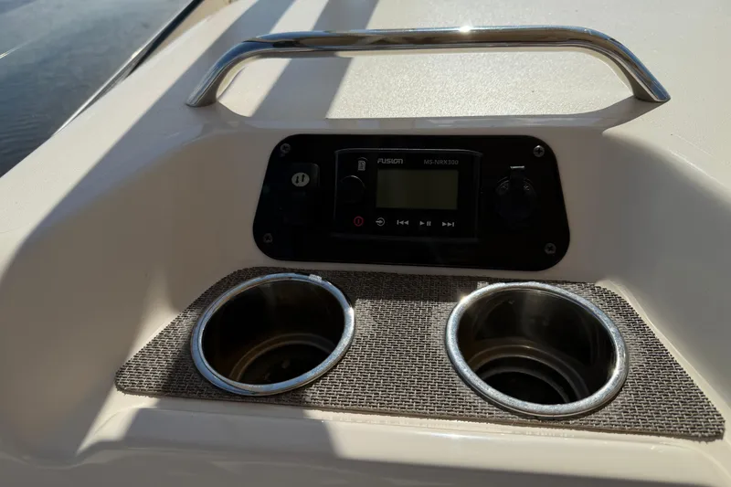 Slide: The Image of 2017 Grady-White Freedom 335 boat console with Fusion MS-NRX300 stereo and cup holders. - 33