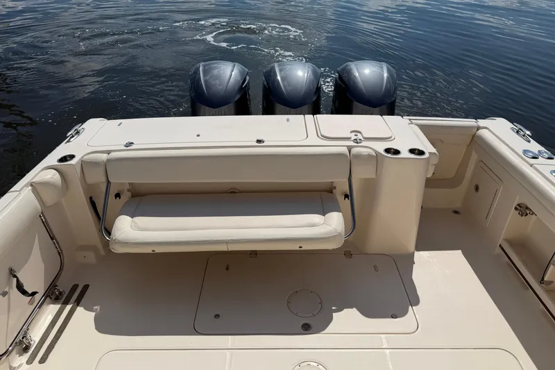 Slide: The Image of 2017 Grady-White Freedom 335 boat with triple engines and spacious seating area. - 46