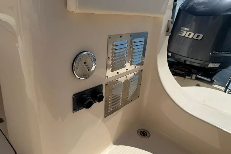 Slide: The Image of 2017 Grady-White Freedom 335 boat interior with Yamaha 300 engine visible. - 50