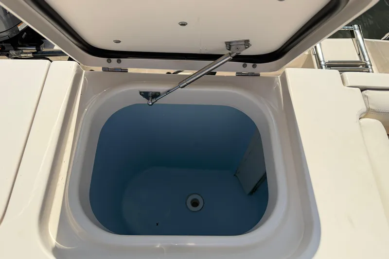 Slide: The Image of Open storage compartment on 2017 Grady-White Freedom 335 boat. - 61
