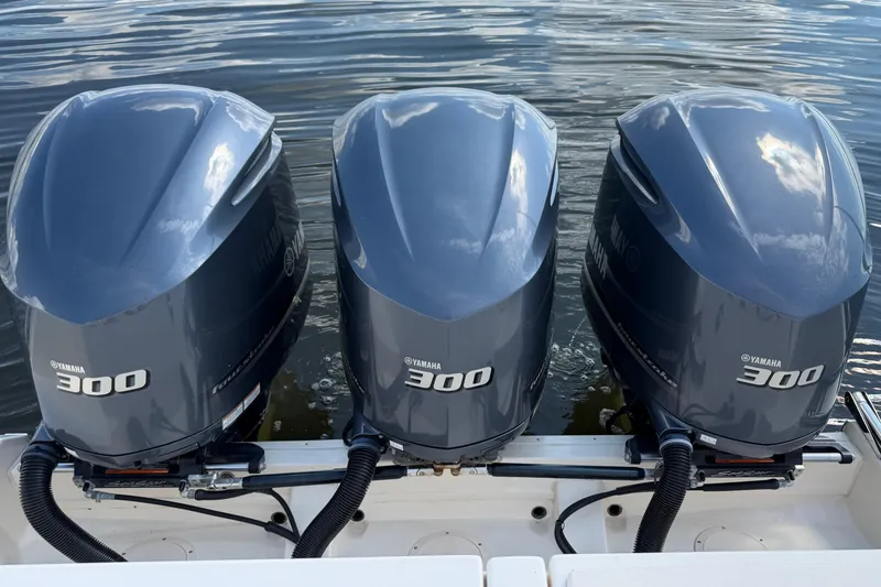 Slide: The Image of Triple Yamaha 300 outboard engines on a 2017 Grady-White Freedom 335 boat. - 64