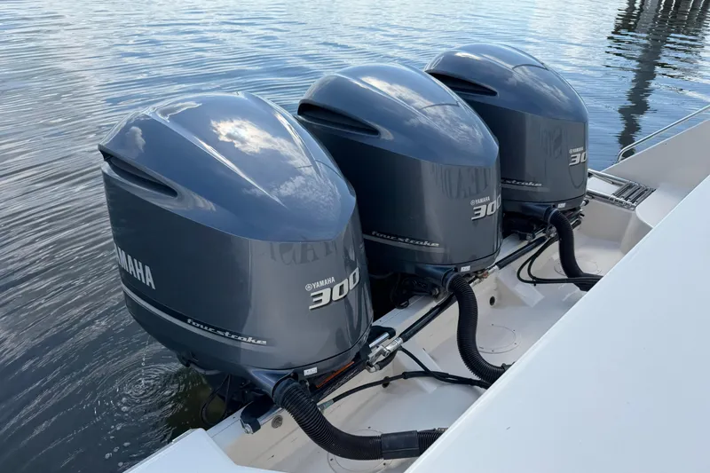 Slide: The Image of Triple Yamaha 300 outboard engines on a 2017 Grady-White Freedom 335 boat. - 66