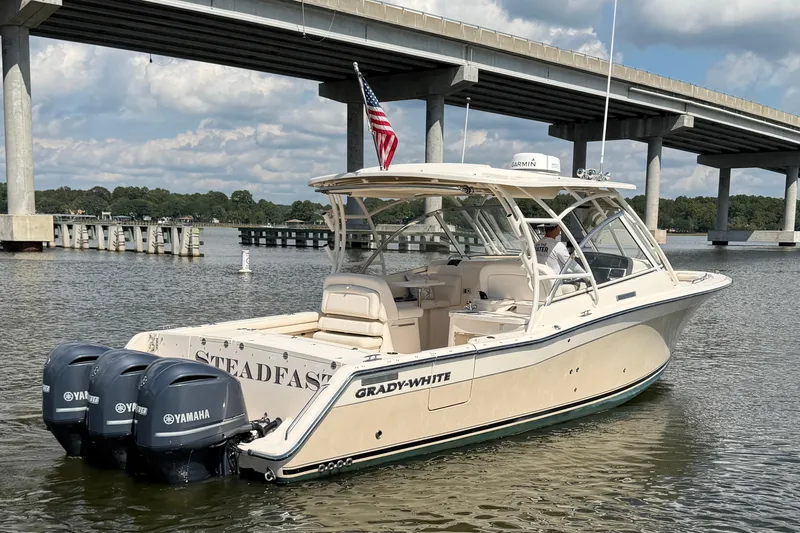 Slide: The Image of 2017 Grady-White Freedom 335 boat with Yamaha engines under a bridge. - 8
