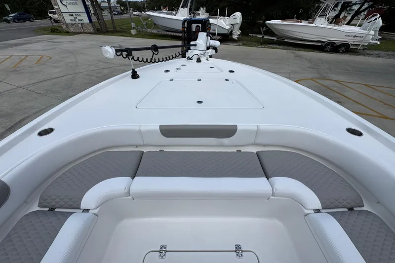 Slide: The Image of 2026 Caymas 28 HB boat interior with cushioned seating and storage compartments. - 20