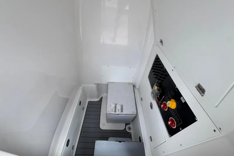 Slide: The Image of Interior view of 2026 Caymas 28 HB boat, featuring control panel and storage area. - 28