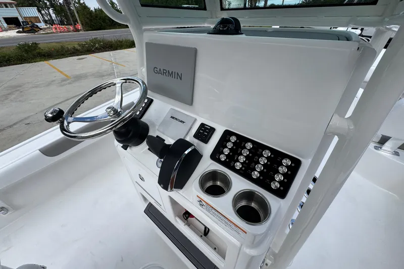 Slide: The Image of 2026 Caymas 28 HB boat console with Garmin display, steering wheel, and control panel. - 35