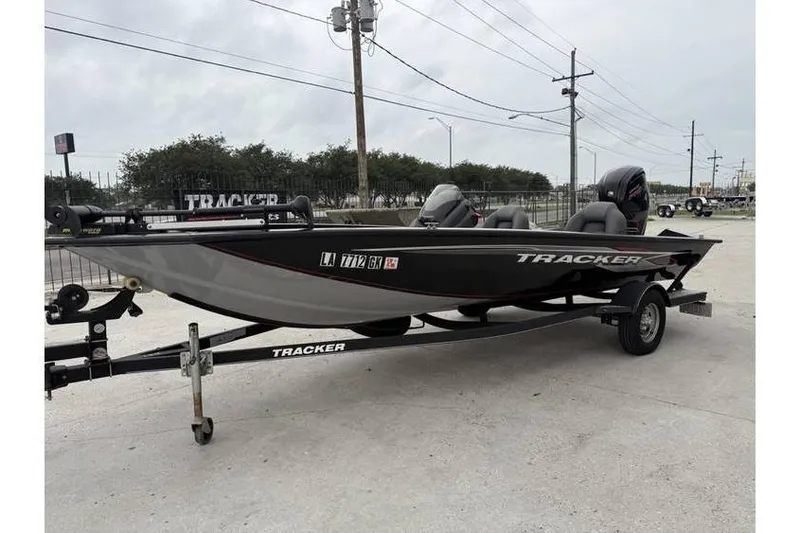 Slide: The Image of 2019 Tracker Pro Team 190 TX boat on trailer, parked outdoors. - 3