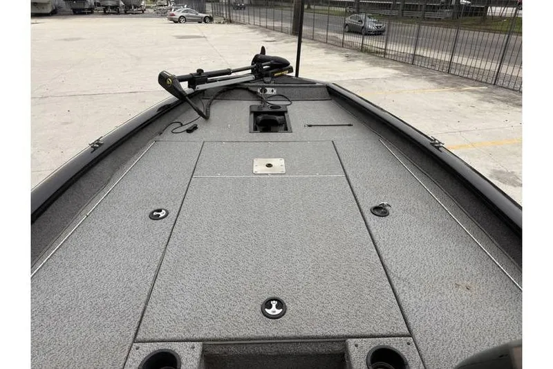 Slide: The Image of 2019 Tracker Pro Team 190 TX boat deck with trolling motor in parking lot. - 7