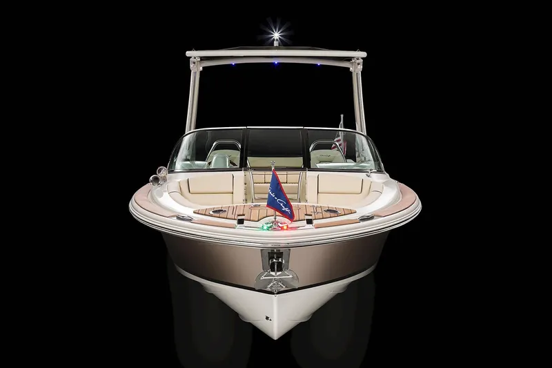 Slide: The Image of Manufacturer Provided Image: 2025 Chris-Craft Launch 25 GT boat, front view, sleek design, black background. - 2