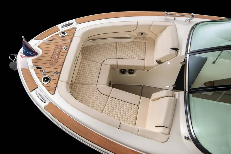 Slide: The Image of Manufacturer Provided Image: 2025 Chris-Craft Launch 25 GT boat interior with luxurious seating and wood accents. - 4