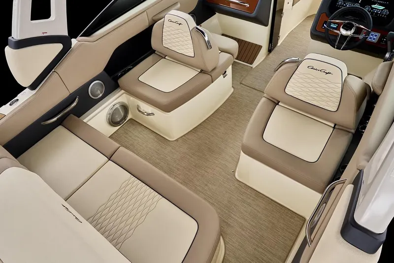 Slide: The Image of 2026 Chris-Craft Sportster 25 boat interior with beige seating and elegant design. - 6