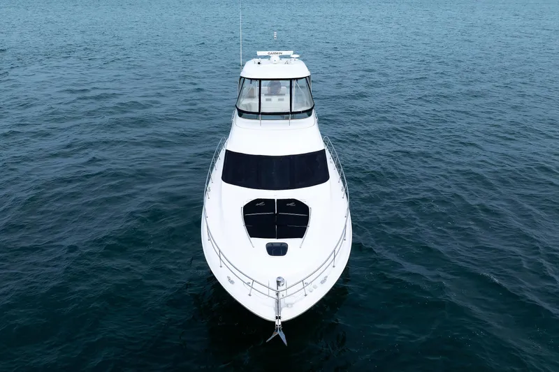 Slide: The Image of 2010 Sea Ray 520 Sedan Bridge yacht on open water, front view. - 11