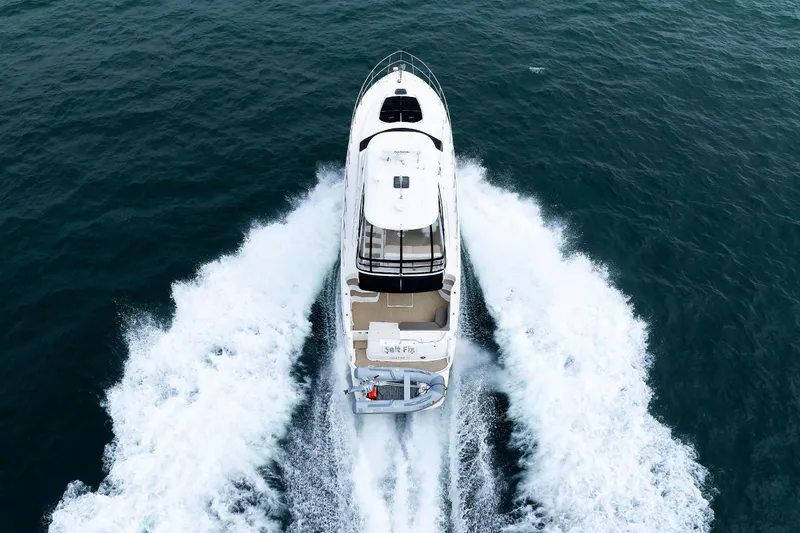 Slide: The Image of Aerial view of 2010 Sea Ray 520 Sedan Bridge yacht cruising on open water. - 15
