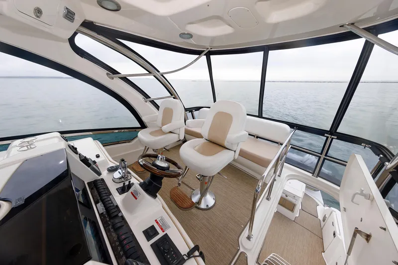 Slide: The Image of Luxurious 2010 Sea Ray 520 Sedan Bridge helm with panoramic ocean views. - 19