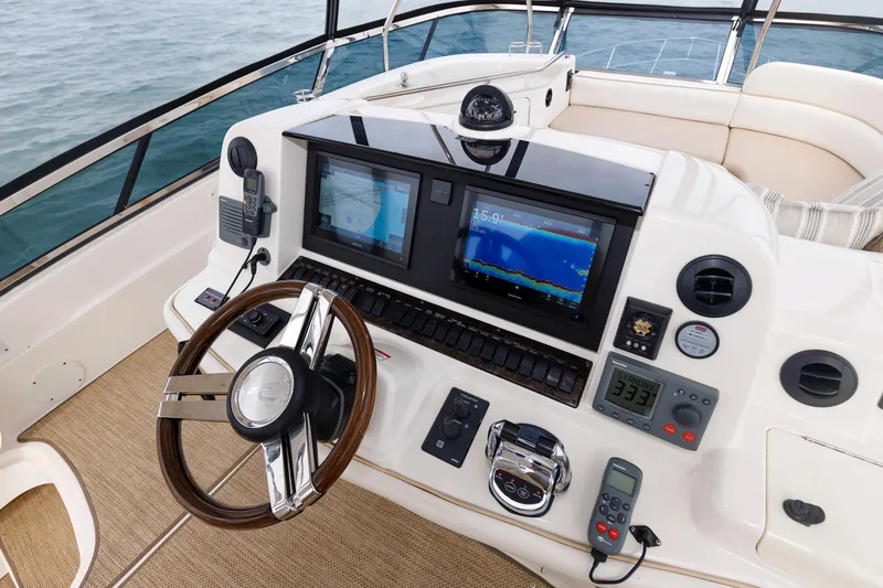 Slide: The Image of Cockpit of 2010 Sea Ray 520 Sedan Bridge with advanced navigation systems. - 21