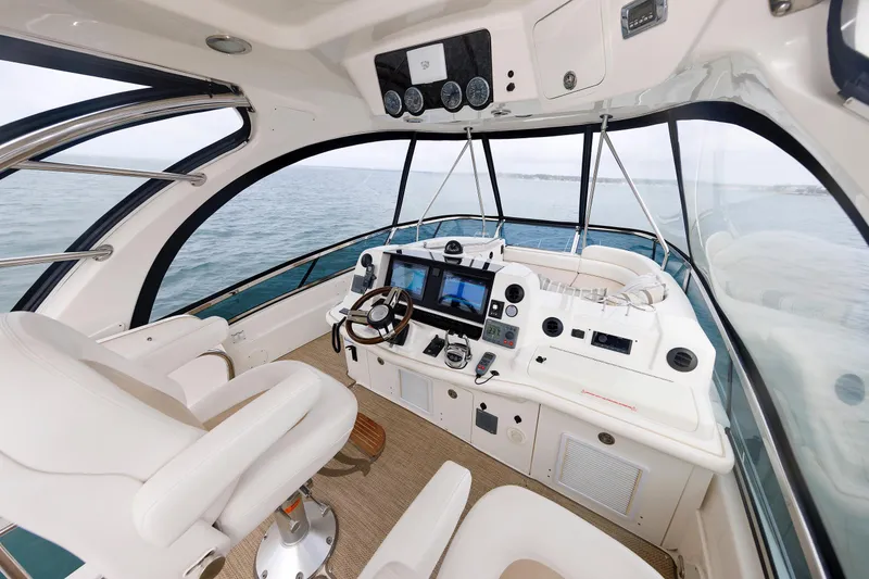 Slide: The Image of Luxurious 2010 Sea Ray 520 Sedan Bridge yacht interior with modern navigation equipment. - 23