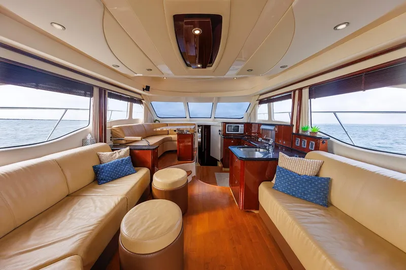 Slide: The Image of Luxurious interior of 2010 Sea Ray 520 Sedan Bridge yacht with elegant seating and ocean view. - 37