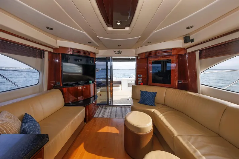 Slide: The Image of Luxurious interior of 2010 Sea Ray 520 Sedan Bridge yacht with leather seating and ocean view. - 39