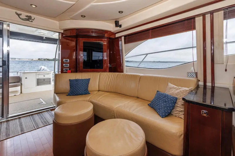 Slide: The Image of Luxurious interior of 2010 Sea Ray 520 Sedan Bridge yacht with leather seating and ocean view. - 40