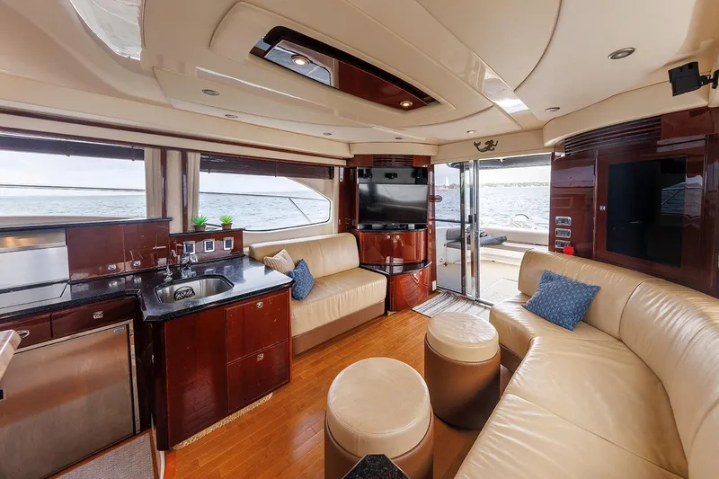 Slide: The Image of Luxurious interior of 2010 Sea Ray 520 Sedan Bridge yacht with leather seating and modern amenities. - 41