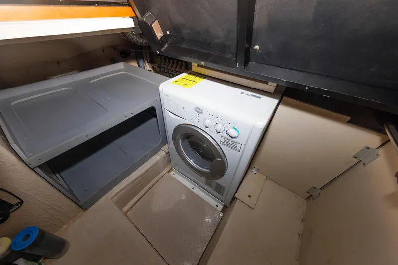 Slide: The Image of Laundry area with washer in 2010 Sea Ray 520 Sedan Bridge yacht. - 51