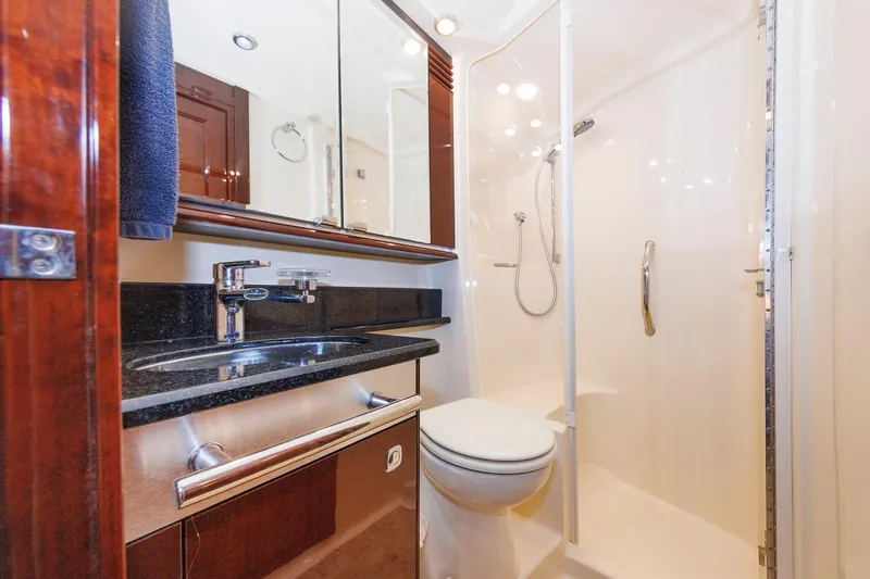 Slide: The Image of Luxurious bathroom in 2010 Sea Ray 520 Sedan Bridge yacht with modern fixtures. - 57