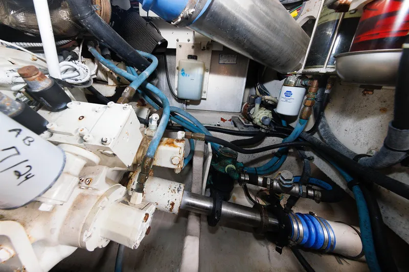 Slide: The Image of Engine room of 2010 Sea Ray 520 Sedan Bridge with visible mechanical components. - 63